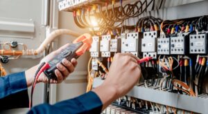 electrician inspecting electrical panel